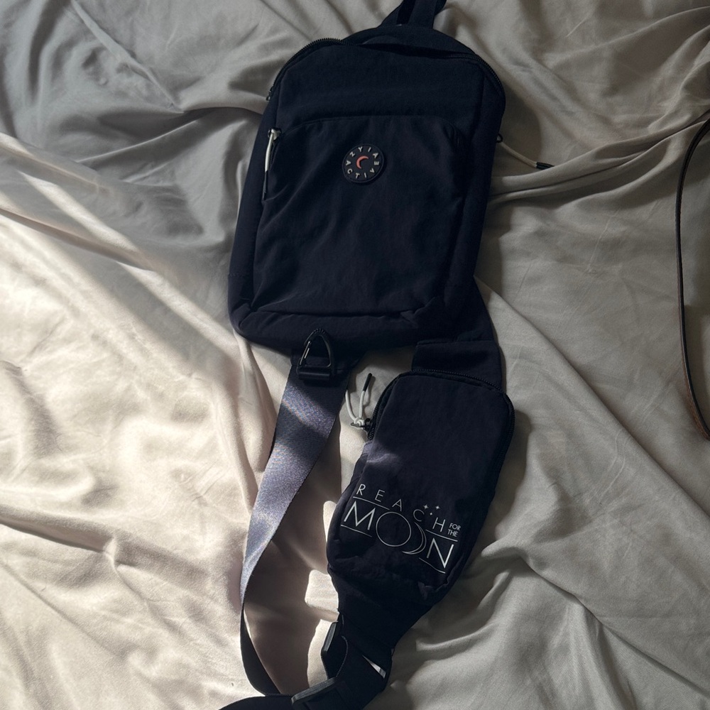 ZYIA Women’s mini black backpack with an extra attached bottle bag